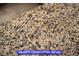 A close-up detail of a granite kitchen countertop at 7365 Mission Hills Dr, Las Vegas, NV 89113