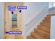 Hallway featuring a stair case with the bathroom, laundry room, garage and kitchen at 7365 Mission Hills Dr, Las Vegas, NV 89113