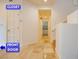 Hallway featuring the front door, closet, and a view into the kitchen at 7365 Mission Hills Dr, Las Vegas, NV 89113