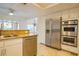 Open kitchen featuring stainless steel appliances and granite countertops at 7365 Mission Hills Dr, Las Vegas, NV 89113