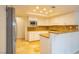 Bright kitchen features white cabinets, granite countertops, and stainless steel appliances at 7365 Mission Hills Dr, Las Vegas, NV 89113