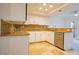 An eat-in kitchen featuring stainless steel appliances, granite countertops, and white cabinets at 7365 Mission Hills Dr, Las Vegas, NV 89113