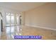 Bright living room with glossy tiled floors and sliding glass doors offering plenty of natural light at 7365 Mission Hills Dr, Las Vegas, NV 89113