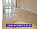 Spacious living room featuring glossy tile flooring, neutral paint, and access to the outdoor patio at 7365 Mission Hills Dr, Las Vegas, NV 89113