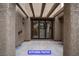 Covered kitchen patio featuring sliding doors and textured stucco walls at 7365 Mission Hills Dr, Las Vegas, NV 89113