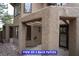 View of two back patios with stucco walls, beams and an outdoor light fixture at 7365 Mission Hills Dr, Las Vegas, NV 89113