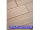 Close up of the neutral colored, stylish shower floor tile layout in primary bathroom at 7365 Mission Hills Dr, Las Vegas, NV 89113