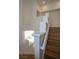 Hardwood stairs with painted walls and railing at 7365 Mission Hills Dr, Las Vegas, NV 89113