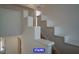 Stairs with painted walls and hardwood steps leading to the upper level at 7365 Mission Hills Dr, Las Vegas, NV 89113