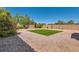 Low-maintenance backyard with gravel landscaping and a patch of artificial turf at 7856 Tolberts Mill Dr, Las Vegas, NV 89131