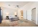 Spacious bedroom with high ceiling includes ensuite bathroom access and bright natural light at 7856 Tolberts Mill Dr, Las Vegas, NV 89131