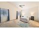 Bright bedroom featuring a ceiling fan, two windows, and neutral decor to create a relaxing ambiance at 7856 Tolberts Mill Dr, Las Vegas, NV 89131