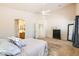 Bright bedroom showing ensuite bathroom access and neutral decor to create a relaxing ambiance at 7856 Tolberts Mill Dr, Las Vegas, NV 89131