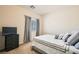 Comfortable bedroom featuring a large window and neutral decor to create a relaxing ambiance at 7856 Tolberts Mill Dr, Las Vegas, NV 89131