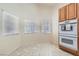 Bright kitchen area with double ovens, ample counter space, lots of natural light, and tile flooring at 7856 Tolberts Mill Dr, Las Vegas, NV 89131