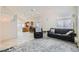 Bright open-concept living room with tile floors, comfortable seating, and adjacent kitchen at 7856 Tolberts Mill Dr, Las Vegas, NV 89131
