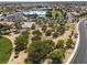 Aerial view of community park with mature trees, meandering path and open field near school at 7904 Seabourn Ct, Las Vegas, NV 89129