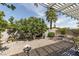 Backyard featuring mature trees and desert landscaping at 7904 Seabourn Ct, Las Vegas, NV 89129