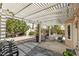 Backyard featuring a pergola, outdoor seating, shade, and drought-tolerant landscaping at 7904 Seabourn Ct, Las Vegas, NV 89129