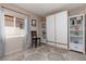 Comfortable bedroom with a built-in Murphy bed, shelving, and natural light from the window at 7904 Seabourn Ct, Las Vegas, NV 89129