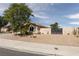 A well-maintained desert landscape is xeriscaped with mature plants to provide privacy from street at 7904 Seabourn Ct, Las Vegas, NV 89129