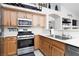 Functional kitchen with stainless steel appliances, and light wood cabinets at 7904 Seabourn Ct, Las Vegas, NV 89129