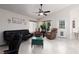 Bright living area features vaulted ceiling, tile flooring, lots of natural light, and neutral color palette at 7904 Seabourn Ct, Las Vegas, NV 89129