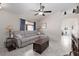 Comfortable living room with neutral tones, ceiling fan, and tile flooring provides an inviting space at 7904 Seabourn Ct, Las Vegas, NV 89129