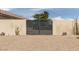 Gated side yard with desert landscaping for low maintenance, plus neutral color stucco wall at 7904 Seabourn Ct, Las Vegas, NV 89129