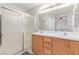 Bright bathroom with a walk-in shower and double sink vanity with ample counter space at 7912 Horn Beam Ct, Las Vegas, NV 89131