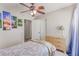 Comfortable bedroom with ceiling fan, and dresser, creating a cozy and inviting atmosphere at 7912 Horn Beam Ct, Las Vegas, NV 89131