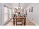 Dining room with natural light, wood table and chairs, and easy access to the kitchen at 7912 Horn Beam Ct, Las Vegas, NV 89131