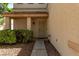 Inviting front porch with a security door, desert landscaping and a neutral color scheme at 7912 Horn Beam Ct, Las Vegas, NV 89131