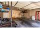 Spacious garage with ample storage and workout equipment, ready for your personal touch at 7912 Horn Beam Ct, Las Vegas, NV 89131