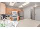 Bright kitchen with wood cabinets, stainless steel fridge, and a view of the countertop at 7912 Horn Beam Ct, Las Vegas, NV 89131
