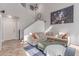 Bright living room with staircase, tile floors, neutral decor, and high ceilings at 7912 Horn Beam Ct, Las Vegas, NV 89131