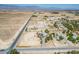 Aerial view of home with expansive lot and desert surroundings in a rural community at 7960 Quarter Horse Ave, Pahrump, NV 89061