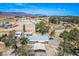 An aerial view of the property showcasing the home with desert landscape and neighborhood at 7960 Quarter Horse Ave, Pahrump, NV 89061
