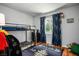 Bright bedroom with a bunk bed, blue curtains, and natural lighting at 7960 Quarter Horse Ave, Pahrump, NV 89061