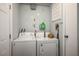 Practical laundry room with a washer, dryer, and functional storage solutions at 7960 Quarter Horse Ave, Pahrump, NV 89061