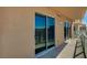 A covered balcony with glass railings and sliding glass doors at 8255 S Las Vegas Blvd # 2004, Las Vegas, NV 89123