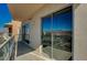 A covered balcony with glass railings features sliding glass doors at 8255 S Las Vegas Blvd # 2004, Las Vegas, NV 89123