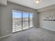Bright bedroom featuring a sliding glass door to a balcony with city views and neutral decor at 8255 S Las Vegas Blvd # 2004, Las Vegas, NV 89123