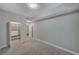 Neutral bedroom with a closet featuring built-in shelving, plush carpeting and doorway to bathroom at 8255 S Las Vegas Blvd # 2004, Las Vegas, NV 89123