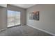 Bright bedroom featuring a sliding glass door to a balcony with city views and neutral decor at 8255 S Las Vegas Blvd # 2004, Las Vegas, NV 89123