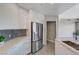 Modern kitchen with stainless steel refrigerator and white countertops at 8255 S Las Vegas Blvd # 2004, Las Vegas, NV 89123