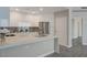 Modern kitchen featuring white cabinets, stainless steel appliances, and a quartz countertop island at 8255 S Las Vegas Blvd # 2004, Las Vegas, NV 89123