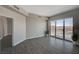 Bright living room boasts neutral walls, tiled flooring, and access to a balcony with scenic city views at 8255 S Las Vegas Blvd # 2004, Las Vegas, NV 89123