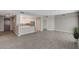 Open-concept layout with tile flooring seamlessly connects the living area to the modern kitchen at 8255 S Las Vegas Blvd # 2004, Las Vegas, NV 89123