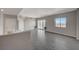Sunlit living room boasts neutral walls, stylish tile floors, and glass doors to a private balcony with views at 8255 S Las Vegas Blvd # 2004, Las Vegas, NV 89123